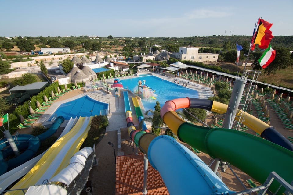 Seasonal outdoor pool, open 9:00 AM to 6:00 PM, pool umbrellas