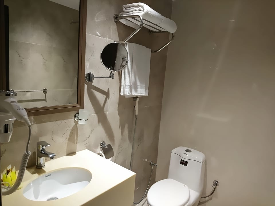 Shower, free toiletries, hair dryer, slippers