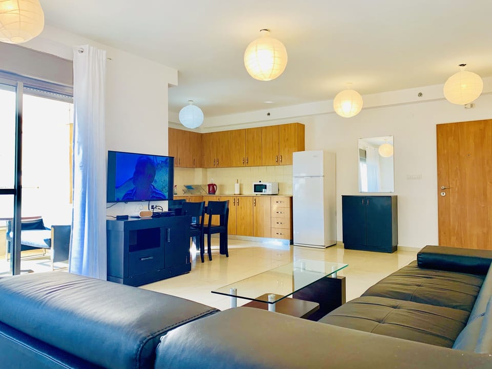 Family Apartment, 3 Bedrooms, Sea View | Living area | Flat-screen TV