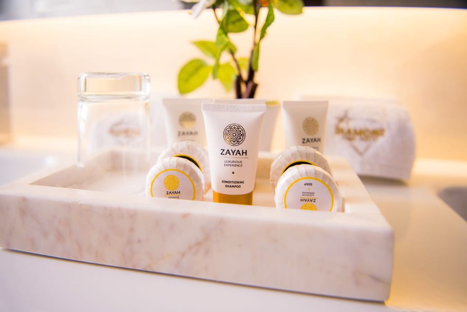 Deluxe Suite, Non Smoking | Bathroom amenities | Shower, rainfall showerhead, free toiletries, hair dryer