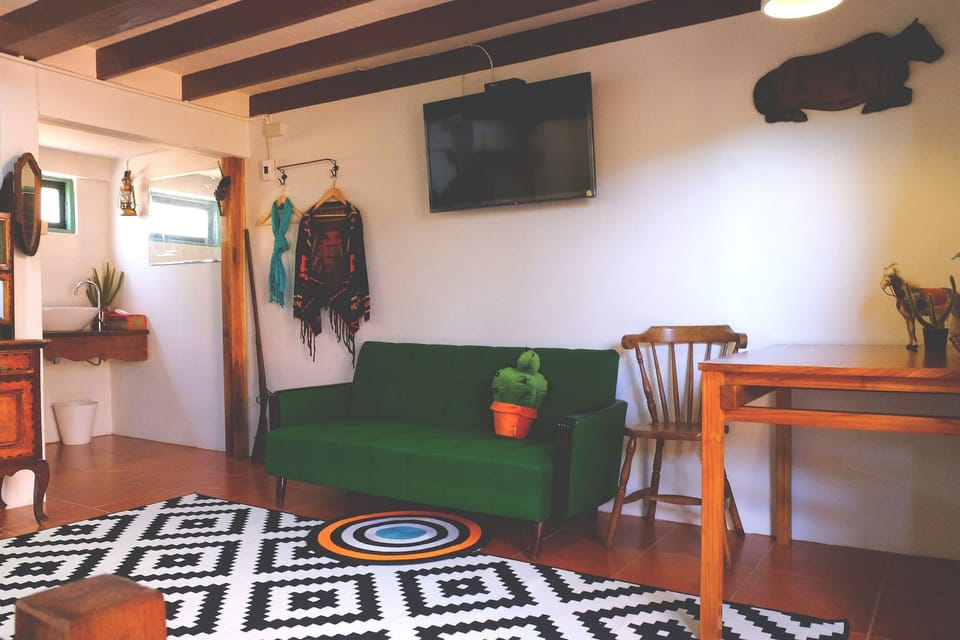 Standard Triple Room | Living area | Flat-screen TV