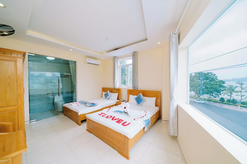 Deluxe Triple Room, 1 Bedroom, Sea View | Minibar, desk, blackout drapes, soundproofing
