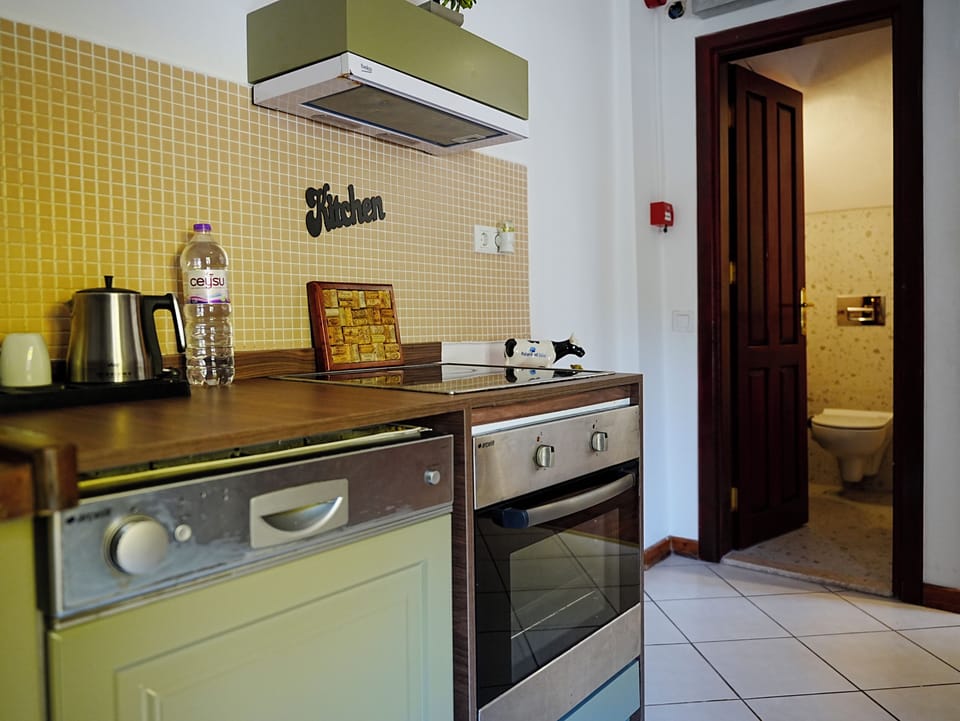 Villa, 2 Bedrooms, Garden View, Garden Area | Private kitchen | Coffee/tea maker, mini-fridge, electric kettle