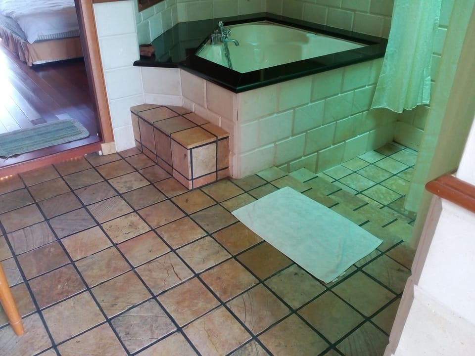 Deluxe Water Chalet Type A | Bathroom | Separate tub and shower, deep soaking tub, rainfall showerhead