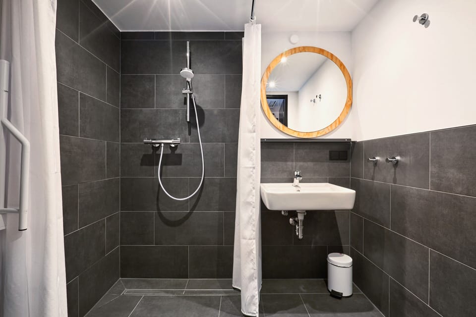 Room with 5 beds and private bathroom, accessible | Bathroom | Shower, towels