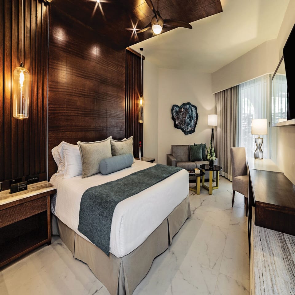 Premium bedding, down comforters, free minibar, in-room safe