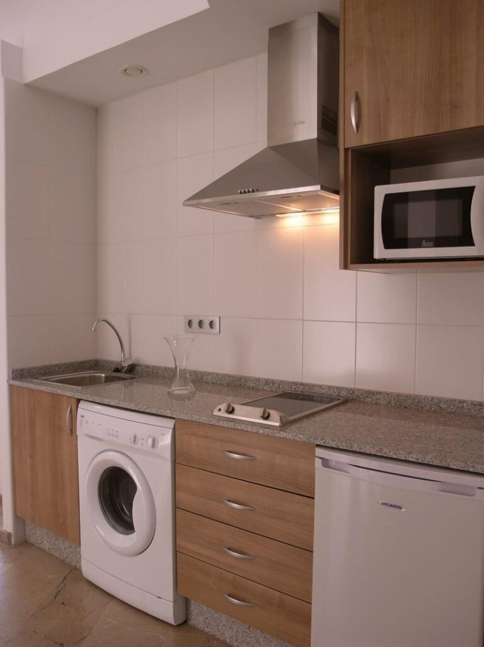 Full-size fridge, microwave, stovetop, cookware/dishes/utensils