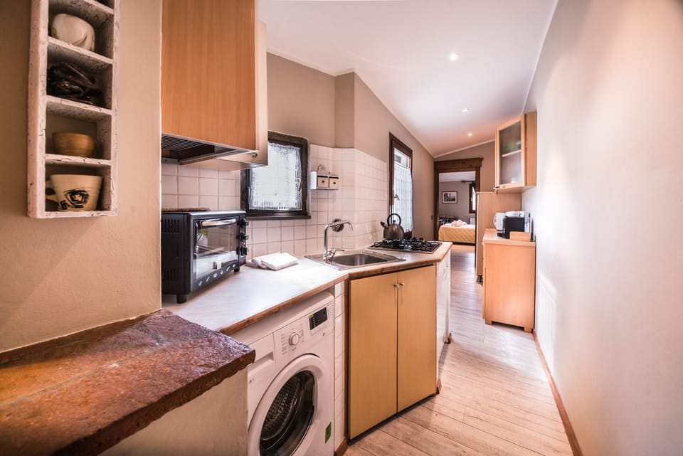Apartment, 2 Bedrooms | Private kitchenette | Full-size fridge, stovetop, cookware/dishes/utensils