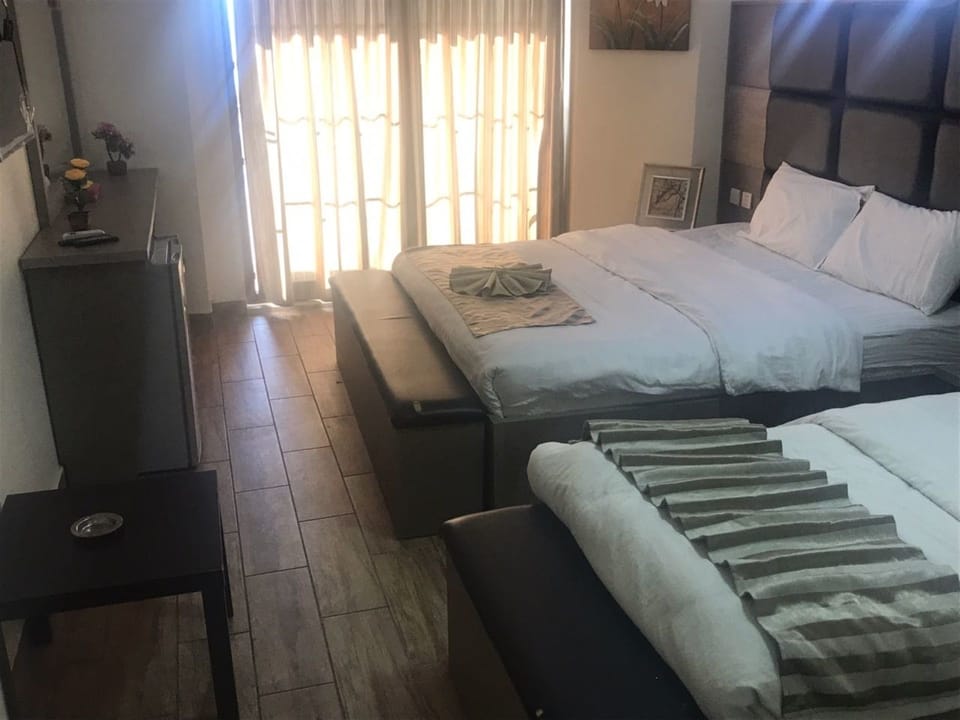 Deluxe Triple Room, Sea View | Desk, free WiFi, bed sheets