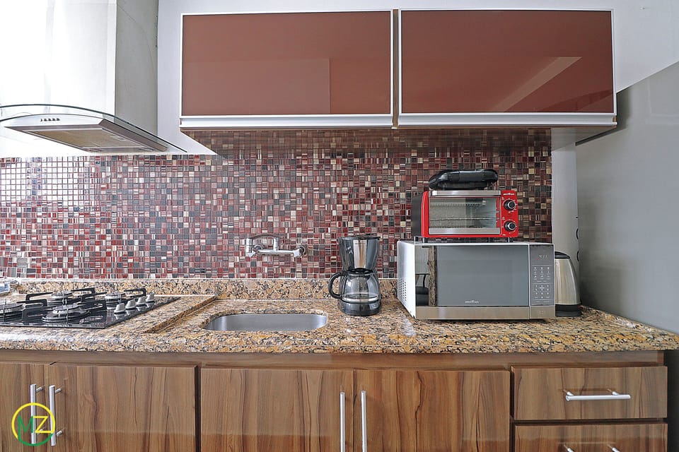 Comfort Penthouse, Multiple Beds, Non Smoking | Private kitchen | Full-size fridge, microwave, cookware/dishes/utensils