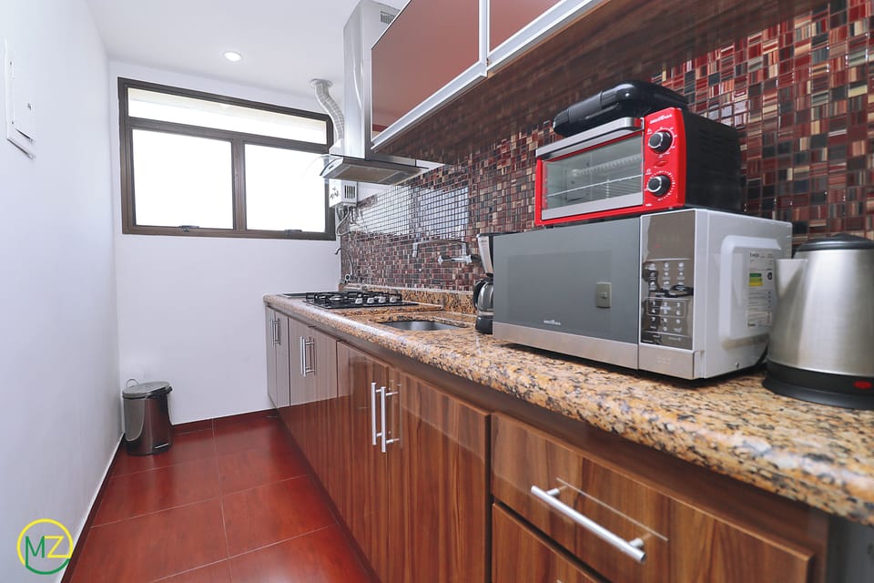 Comfort Penthouse, Multiple Beds, Non Smoking | Private kitchen | Full-size fridge, microwave, cookware/dishes/utensils