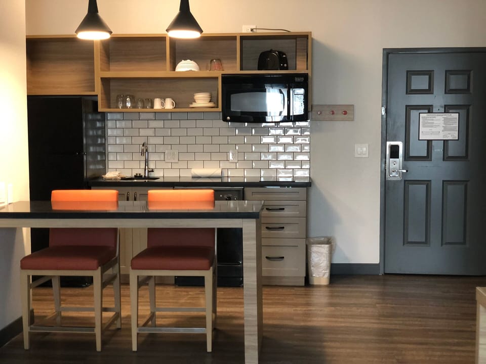 Suite, 1 King Bed | Private kitchen | Coffee/tea maker, full-size fridge, stovetop, cookware/dishes/utensils