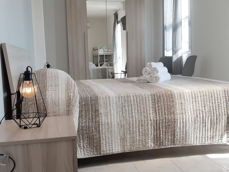 Superior Quadruple Room | Minibar, in-room safe, desk, travel crib