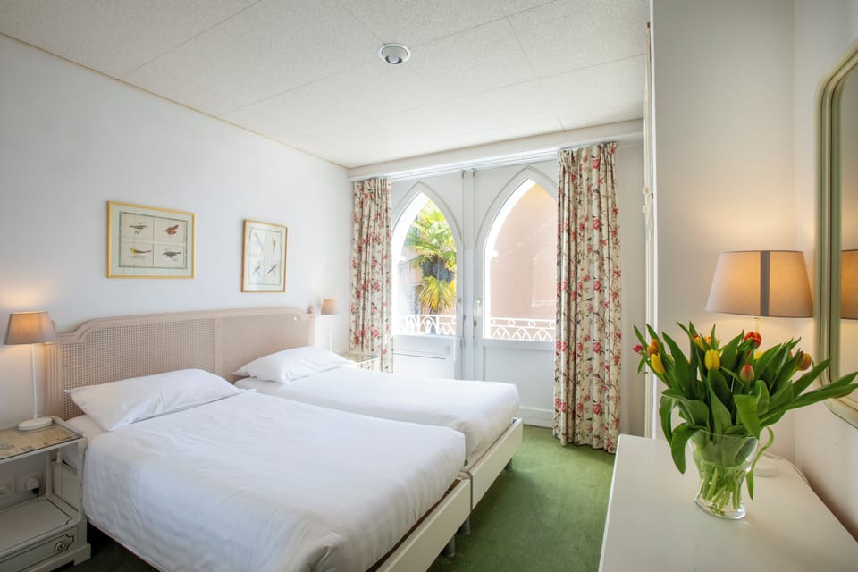 Basic Double Room, 2 Twin Beds, Non Smoking | Down comforters, minibar, blackout drapes, free WiFi