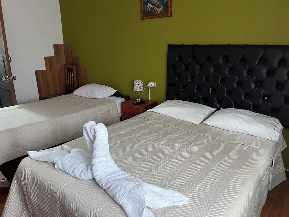 Triple Room, Private Bathroom | Desk, free WiFi, bed sheets