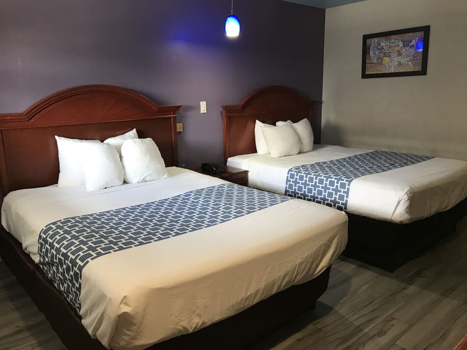 Standard Room, 2 Queen Beds | Down comforters, desk, blackout drapes, iron/ironing board