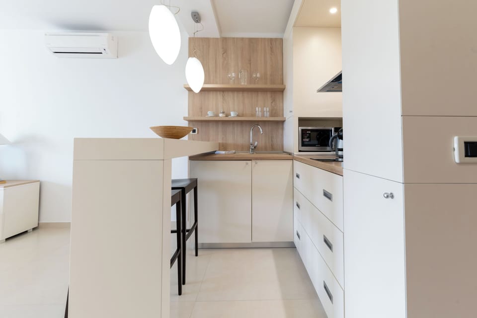 Superior Studio Suite, Balcony, Sea View | Private kitchen | Coffee/tea maker, electric kettle, cleaning supplies