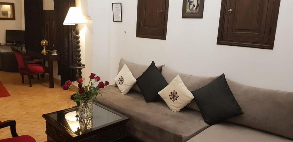 Superior Quadruple Room | Living area | Flat-screen TV, DVD player