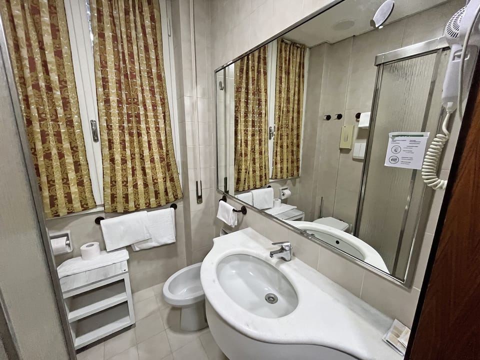 Triple Room | Bathroom | Shower, free toiletries, hair dryer, bathrobes