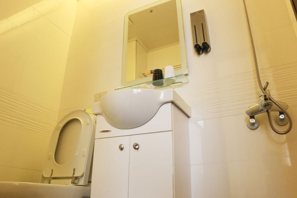 Shower, free toiletries, hair dryer, slippers
