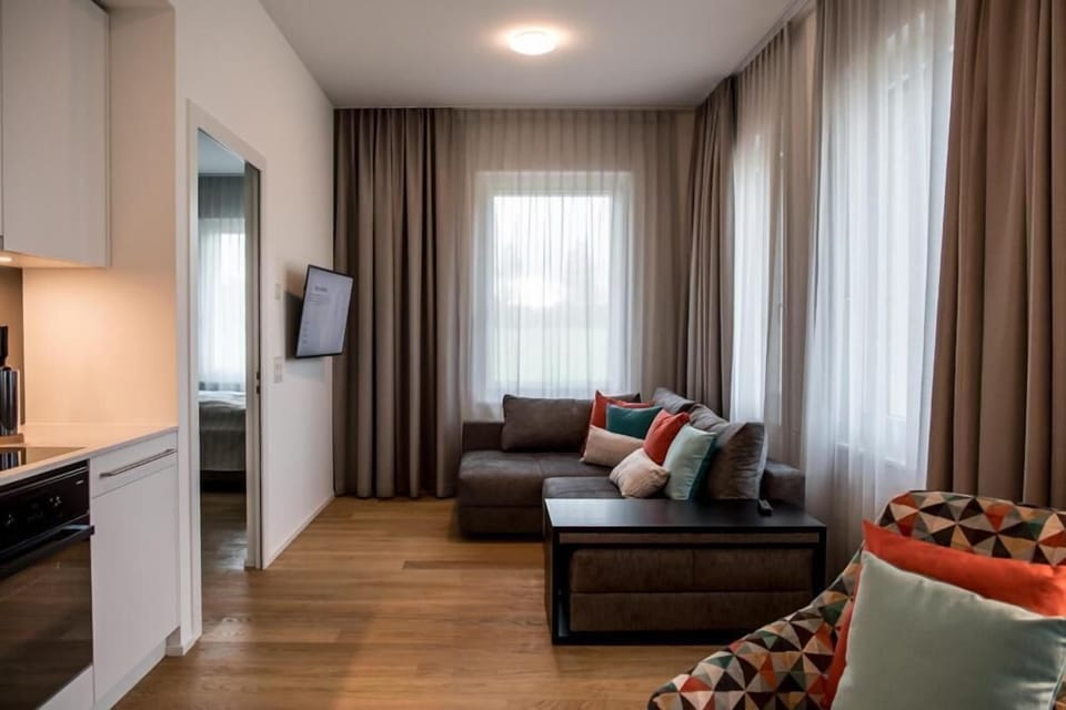 Junior Apartment | Living room | 32-inch flat-screen TV with digital channels