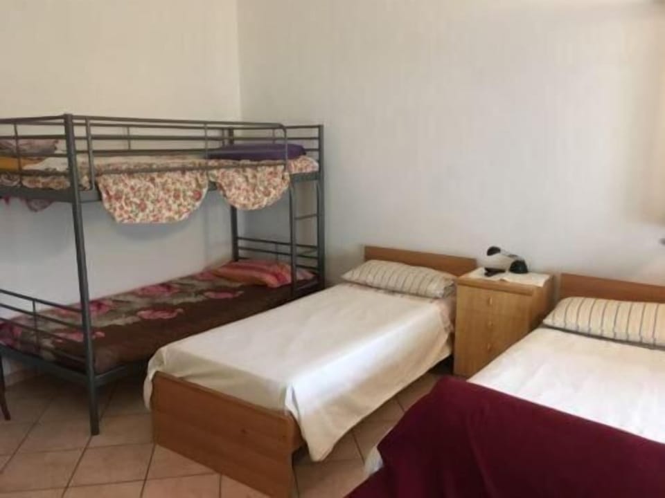 Desk, iron/ironing board, bed sheets