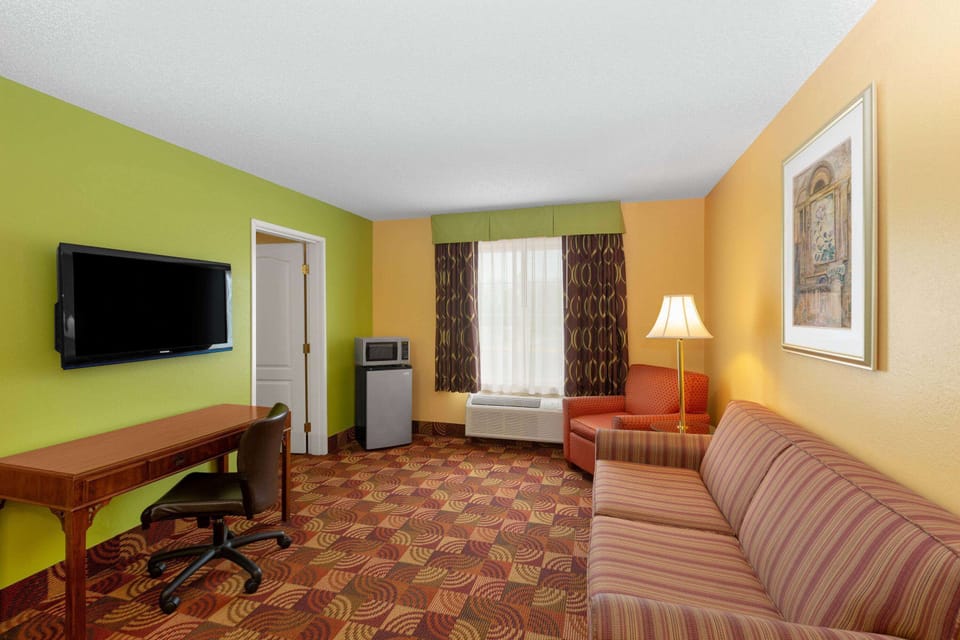 Suite, 1 King Bed, Non Smoking | Pillowtop beds, individually furnished, desk, blackout drapes