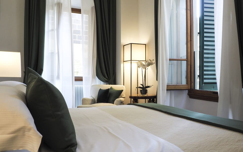 Deluxe Room | Minibar, in-room safe, iron/ironing board, free WiFi