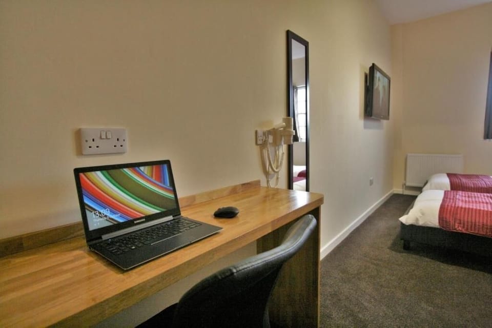 Desk, laptop workspace, free WiFi, bed sheets