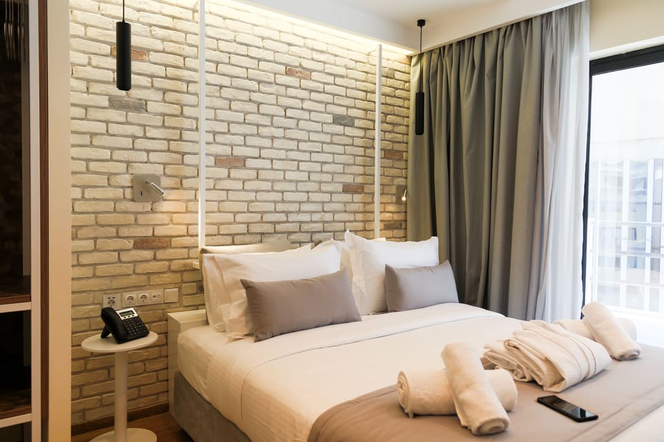 Deluxe Room, Balcony | In-room safe, desk, laptop workspace, soundproofing