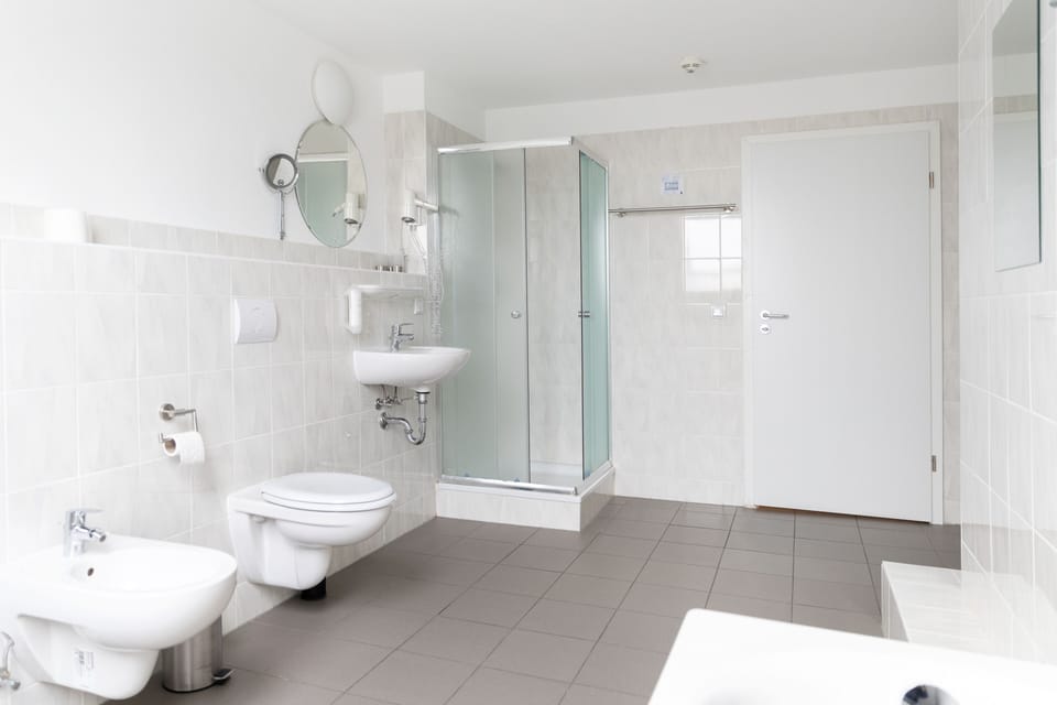 Junior Suite (5 guests) | Bathroom | Shower, hair dryer, towels