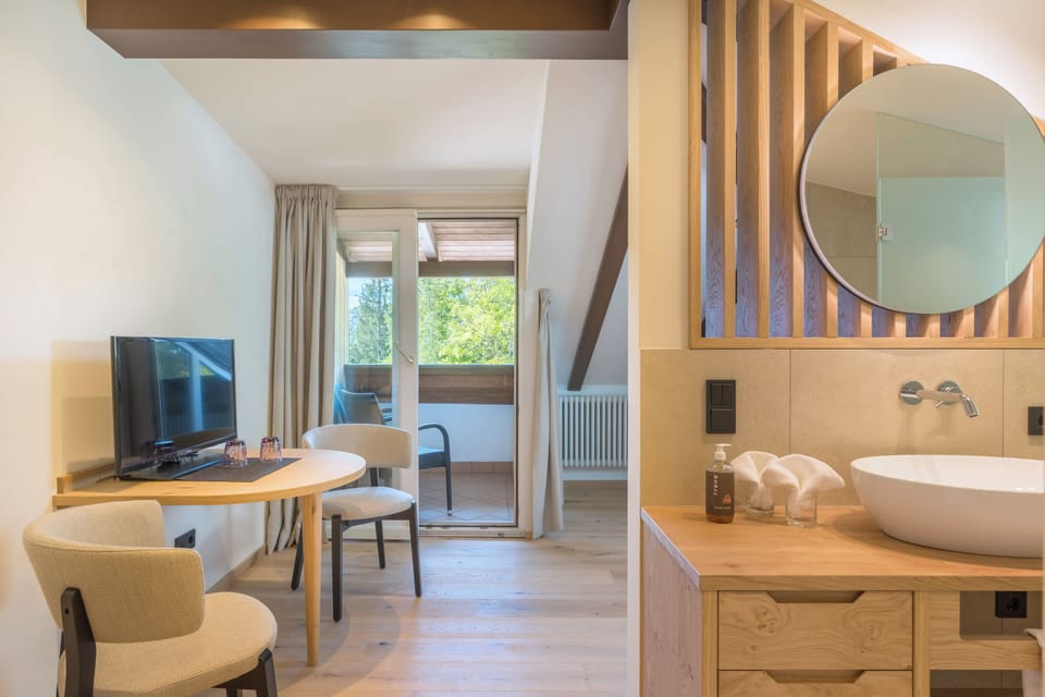 Junior Suite, Balcony, Garden Area | Hypo-allergenic bedding, in-room safe, desk, blackout drapes