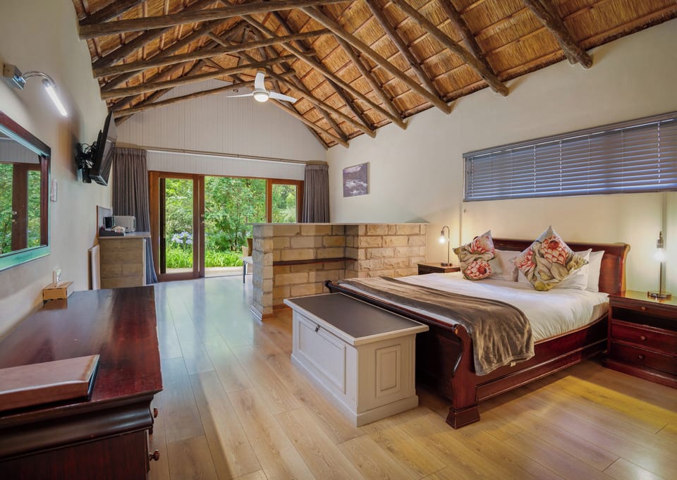 Family Room, Garden View | In-room safe, desk, laptop workspace, iron/ironing board