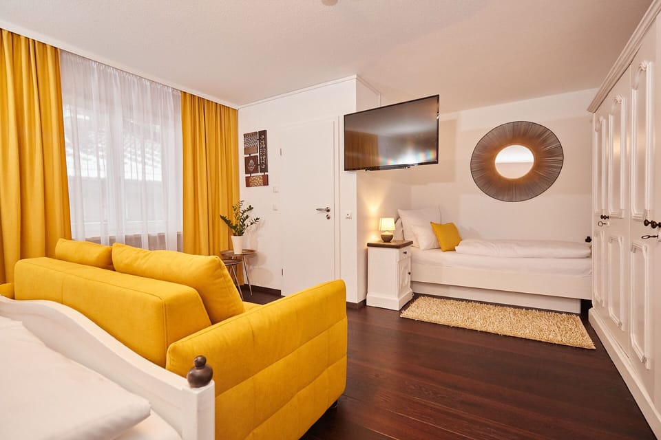 Standard Triple Room | Living area | TV