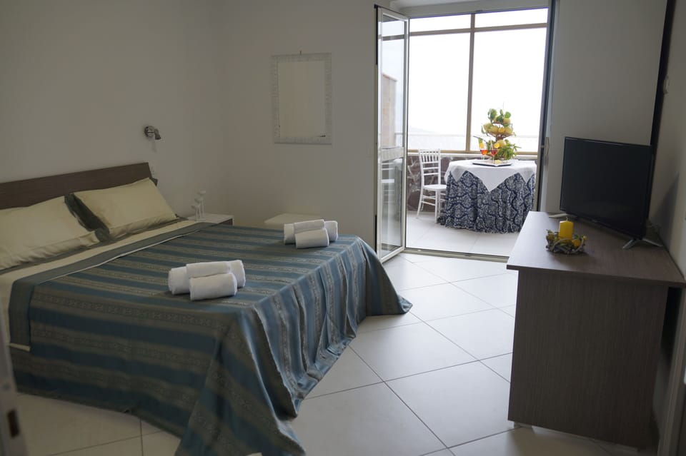 Deluxe Double Room, Patio, Sea View | Hypo-allergenic bedding, desk, blackout drapes, soundproofing