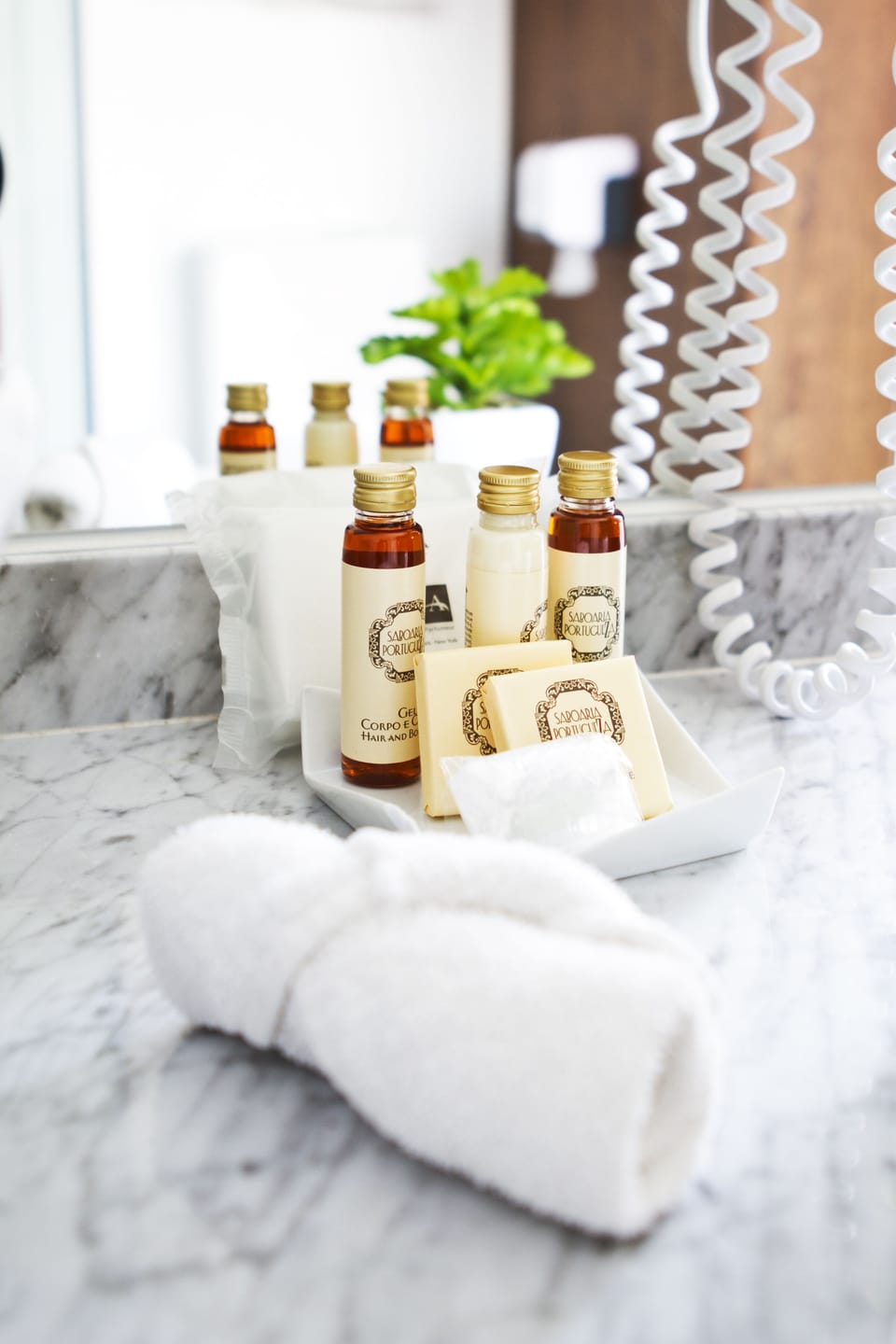 Shower, designer toiletries, hair dryer, towels