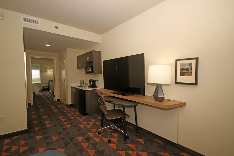 Suite, 1 King Bed | Living area | Flat-screen TV, iPod dock