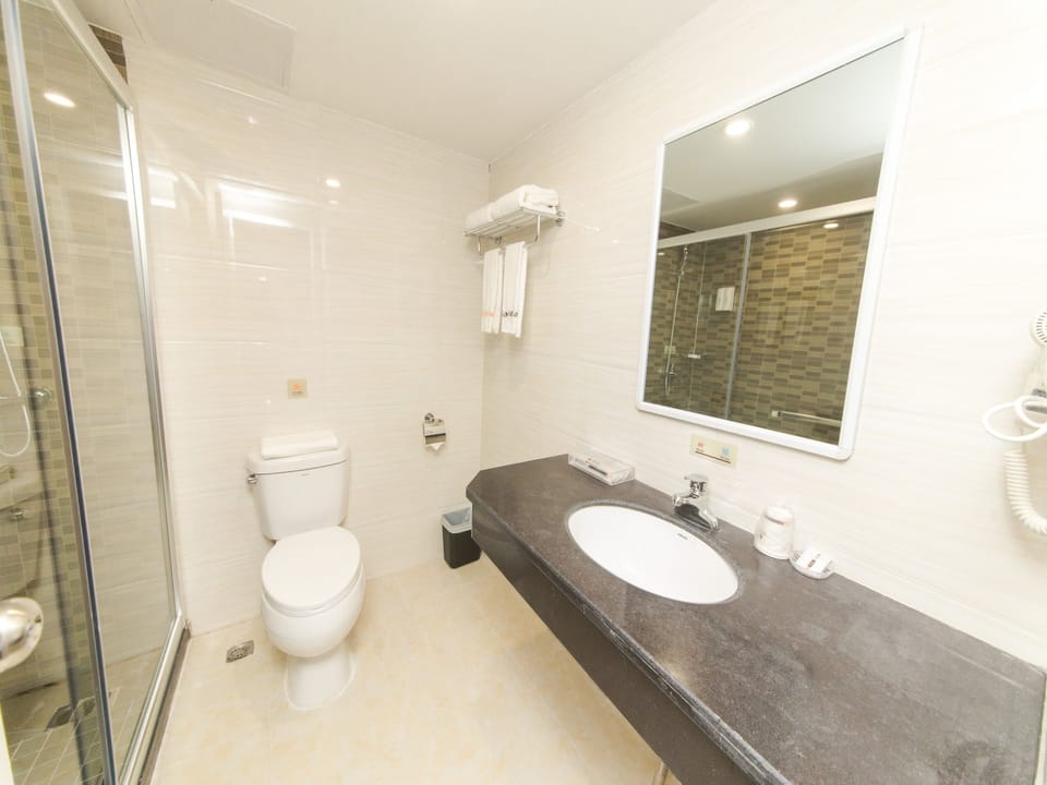 Shower, free toiletries, hair dryer, slippers