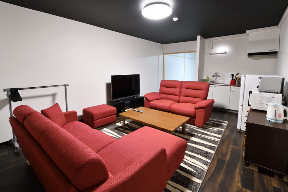 Private Vacation Home 1F | Living area | 50-inch flat-screen TV with digital channels, TV