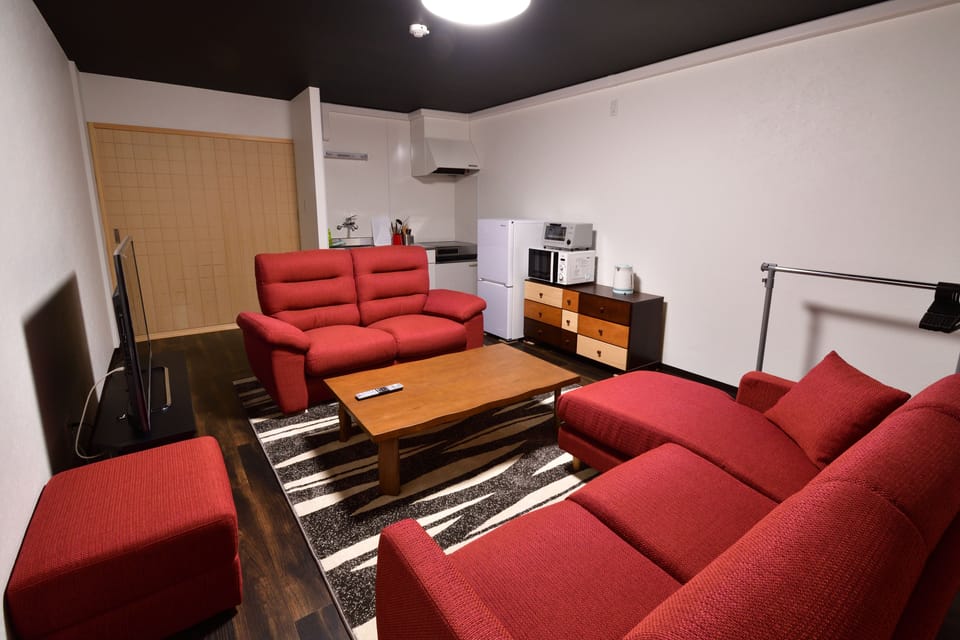 Private Vacation Home 1F | Living area | 50-inch flat-screen TV with digital channels, TV