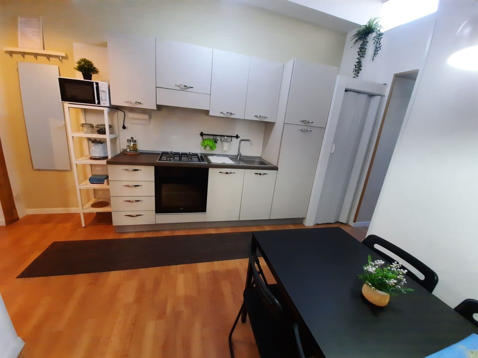Comfort Apartment | Private kitchen | Cookware/dishes/utensils, cleaning supplies, paper towels