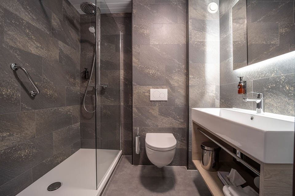 Shower, eco-friendly toiletries, hair dryer, towels