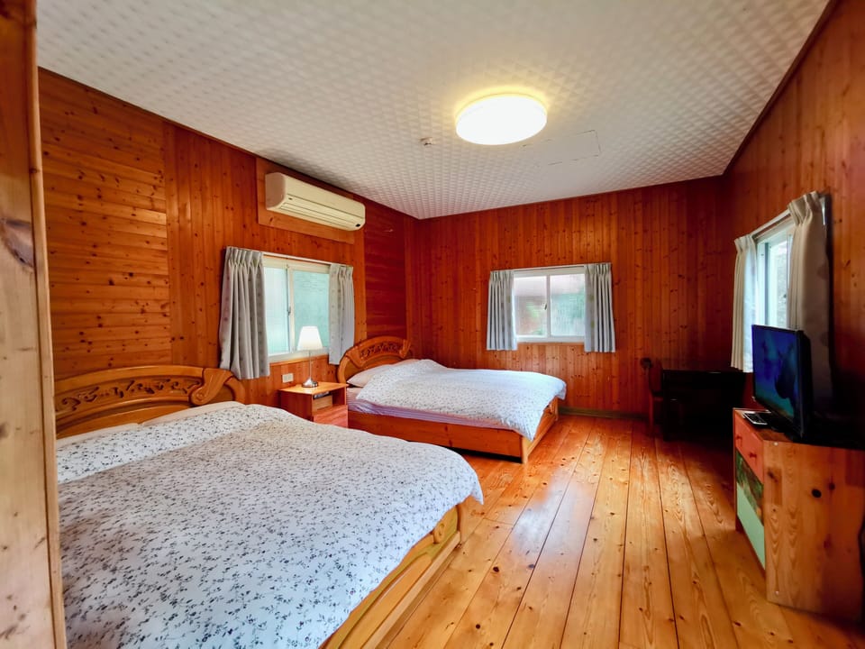 Standard Quadruple Room | Down comforters, desk, laptop workspace, blackout drapes