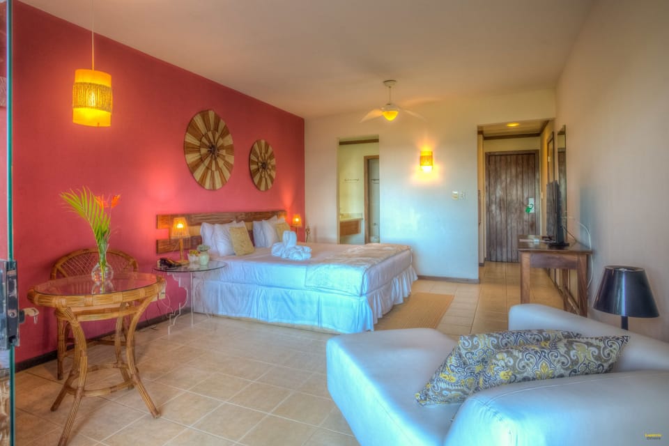 Superior Apartment, 1 King Bed, Non Smoking, Partial Sea View | Minibar, in-room safe, desk, blackout drapes