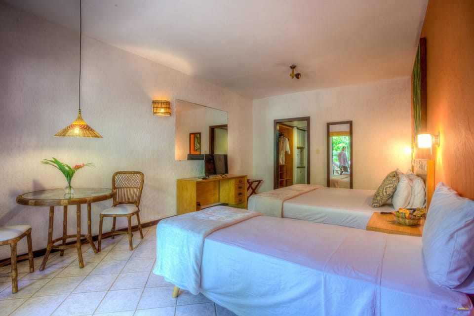 Deluxe Apartment, Garden View | Minibar, in-room safe, desk, blackout drapes
