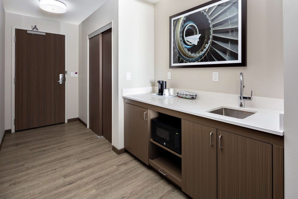 Suite, 1 King Bed | Private kitchen | Mini-fridge, microwave, coffee/tea maker, eco-friendly cleaning products