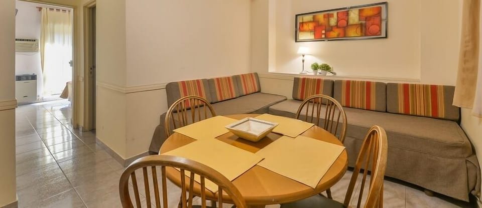 Superior Apartment, Multiple Beds | Living area | 32-inch Smart TV with cable channels