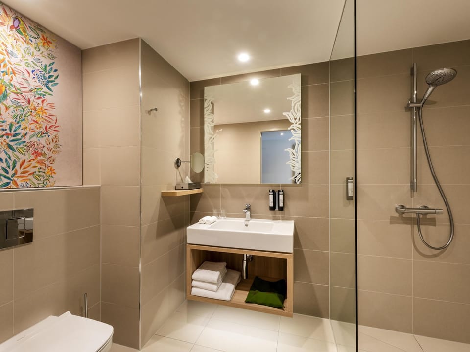 Shower, rainfall showerhead, designer toiletries, hair dryer