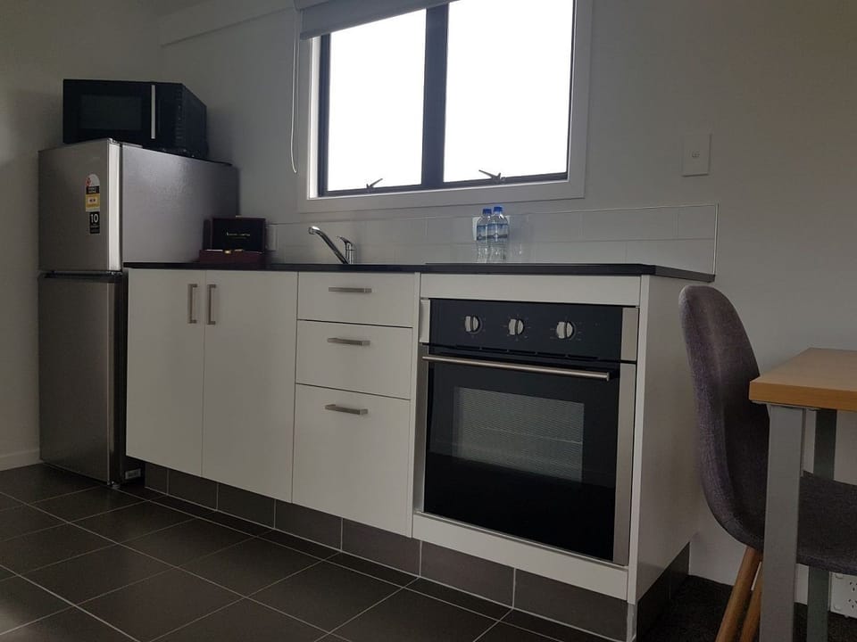 Motel Family Rooms with King - 2 Bedrooms | Private kitchen | Shared fridge, microwave
