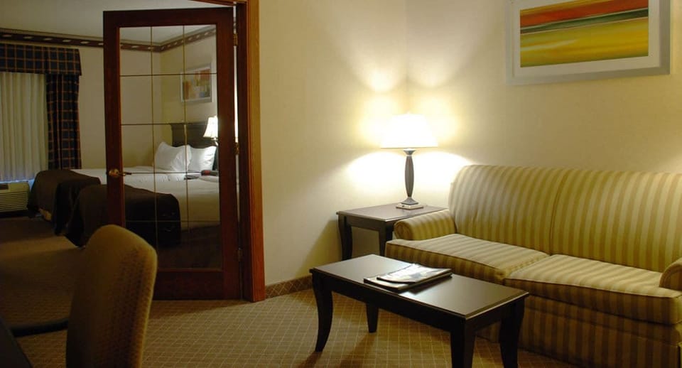 Family Suite, 1 Bedroom | Blackout drapes, iron/ironing board, free cribs/infant beds
